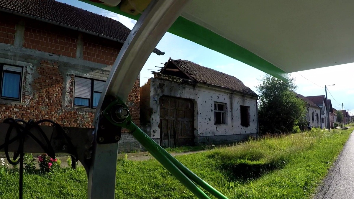 In between nice lived in houses were many homes that were long ago abandoned and still bearing the bullet holes and scars of war with Serbia