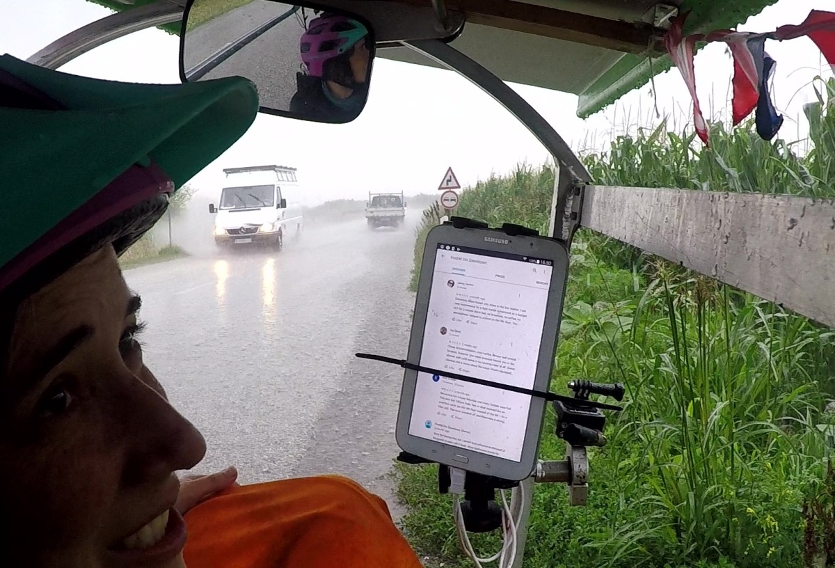 Anne-Sophie put on her best spirits duruing the downpour, even as passing cars would drench us with side spray.