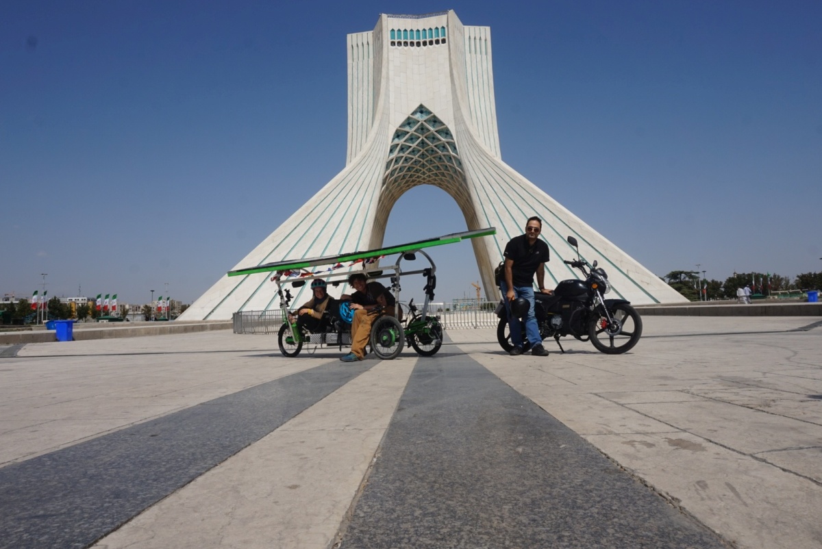 Shahab took the electric motorcycle with me and AnSo on our reassembled trike as we braved the busy streets and aggressive traffic of Tehran to visit Azadi Square. This was both for a photo op and to meet with the associated press for a TV interview piece.