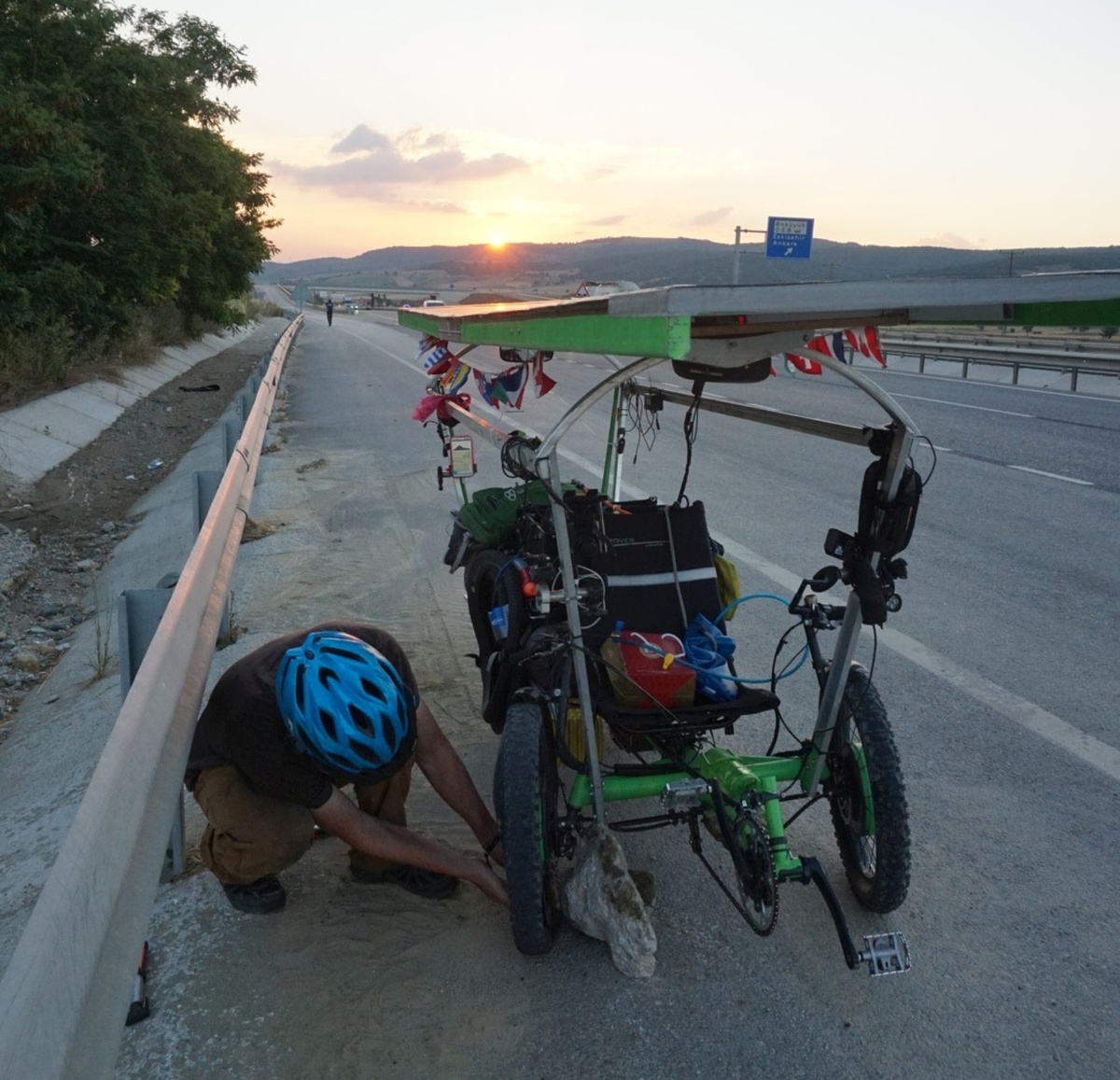 We ended up with a pretty efficient system for dealing with flat tires as they came up, and it started by finding a nearby rock or object on which to prop the trike frame so that the wheel was off the ground.