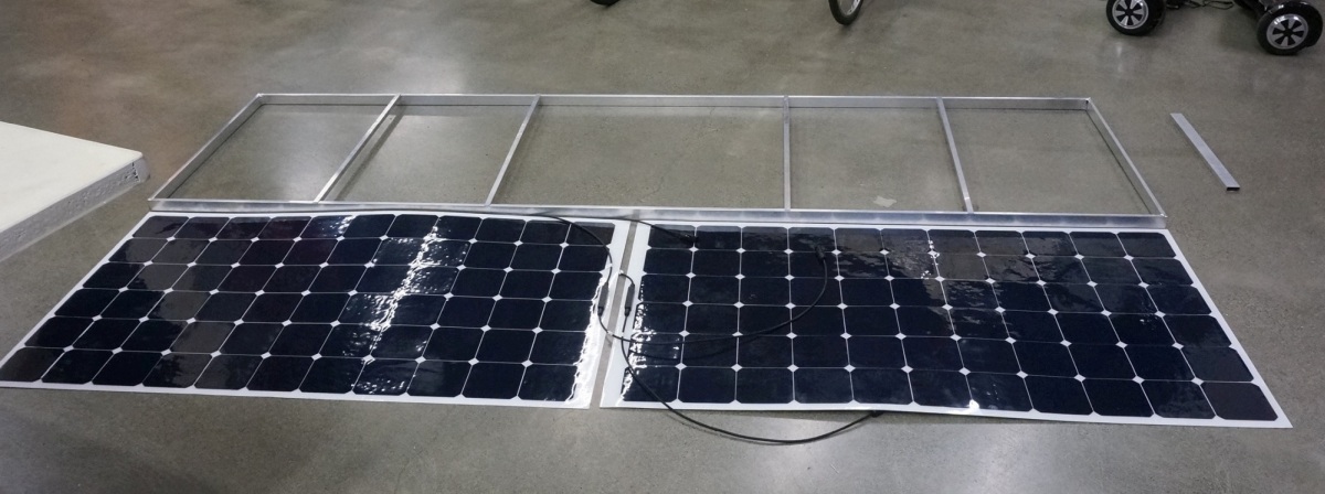 The intitial solar roof design used thin walled rectangular aluminum tubing , and supported just two 200W nominal panels.